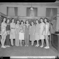 Meyers Brothers (278 West Main and Mill Streets); interior, two women in bathing suites standing with a group of women; group portrait, 1942.pdf